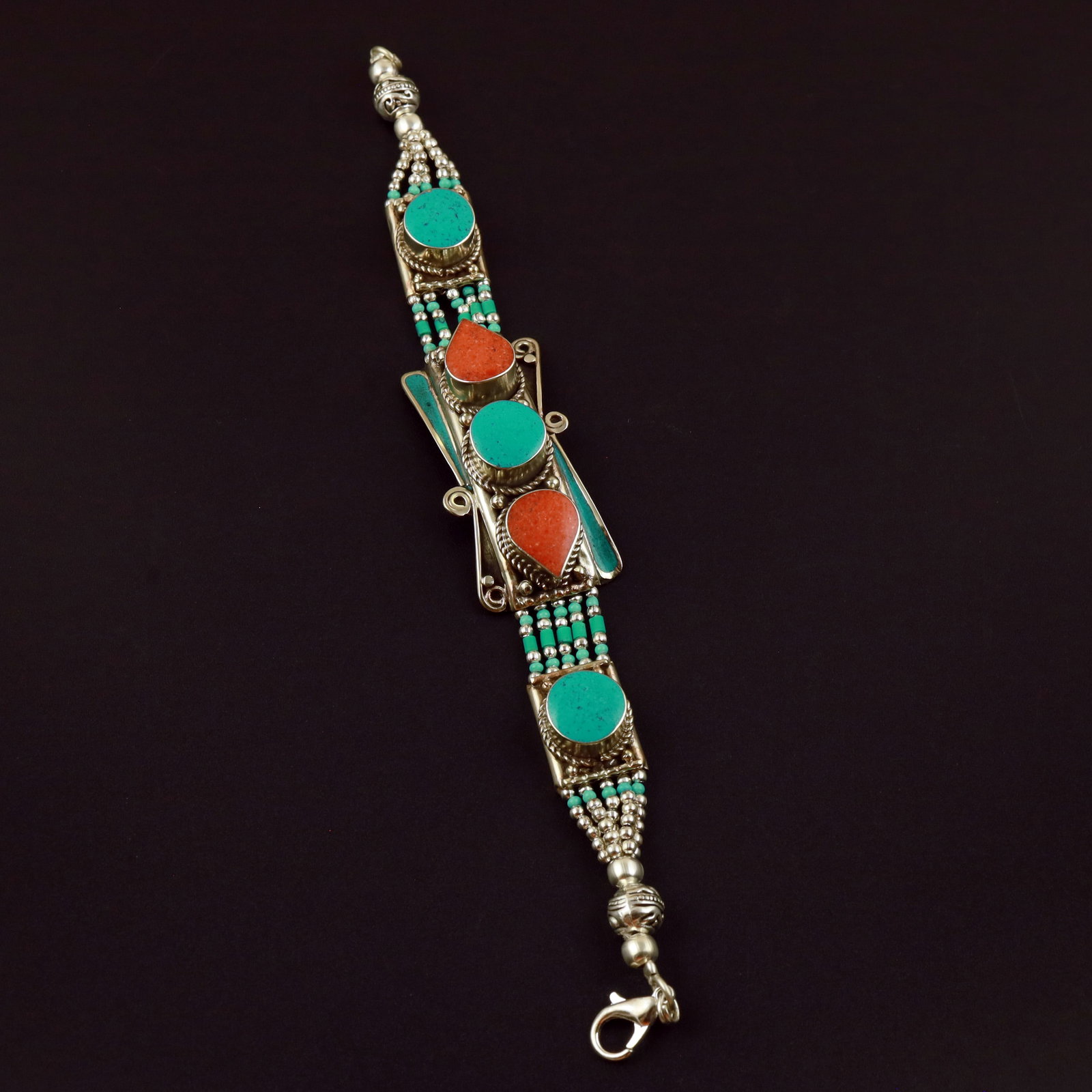 Tibetan Natural Turquoise & Coral Handmade Bold Bracelet: Product ID: 260513131849 Product - Tibetan Handmade Ethnic Bracelet Gemstone - Natural Turquoise & Coral Size - 7 Inch Weight - 50 Gram Approx Metal - Brass & Copper mix Metal Origin - Nepal Country/R