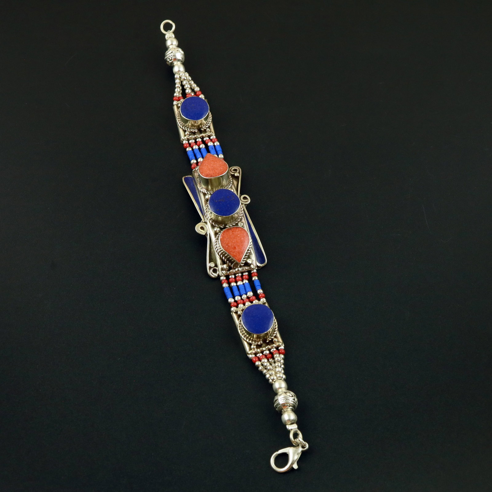 Tibetan Natural Lapis Lazuli & Coral Handmade Bracelet: Product ID: 260513130221 Product - Tibetan Handmade Ethnic Bracelet Gemstone - Natural Lapis Lazuli & Coral Size - 7 Inch Weight - 50 Gram Approx Metal - Brass & Copper mix Metal Origin - Nepal Countr