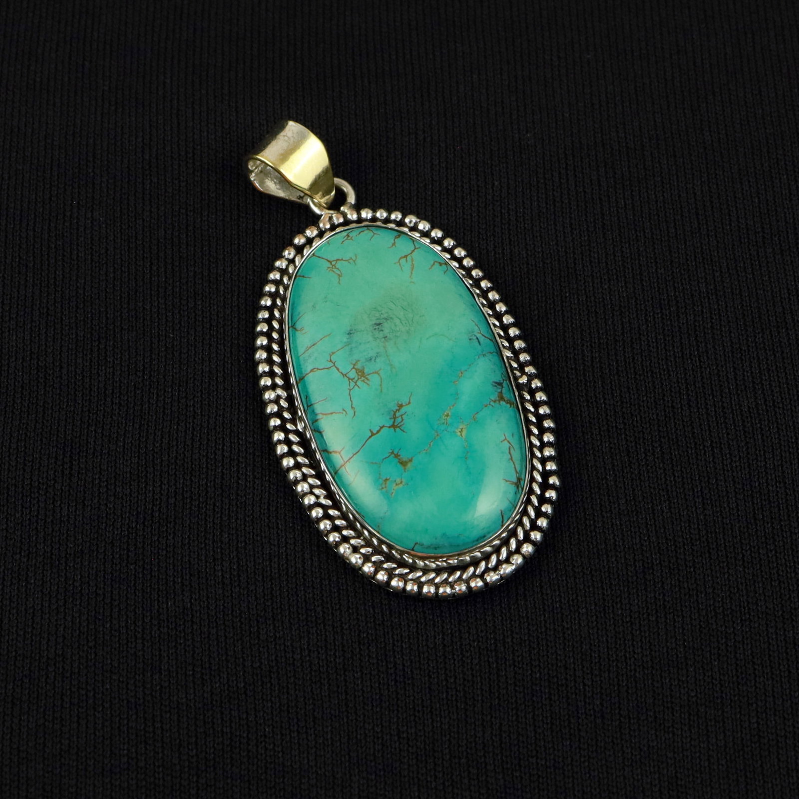 Natural Turquoise Sterling Silver Plated Handmade Pendant: Product ID: 260517183701 Product - Handmade Silver Plated Pendant Metal - 92.5 Sterling Silver Plated Pendant Size - 4.5x3 CM Gemstone - Turquoise Gemstone Origin - Tibet Gemstone Shape - Oval Pendant