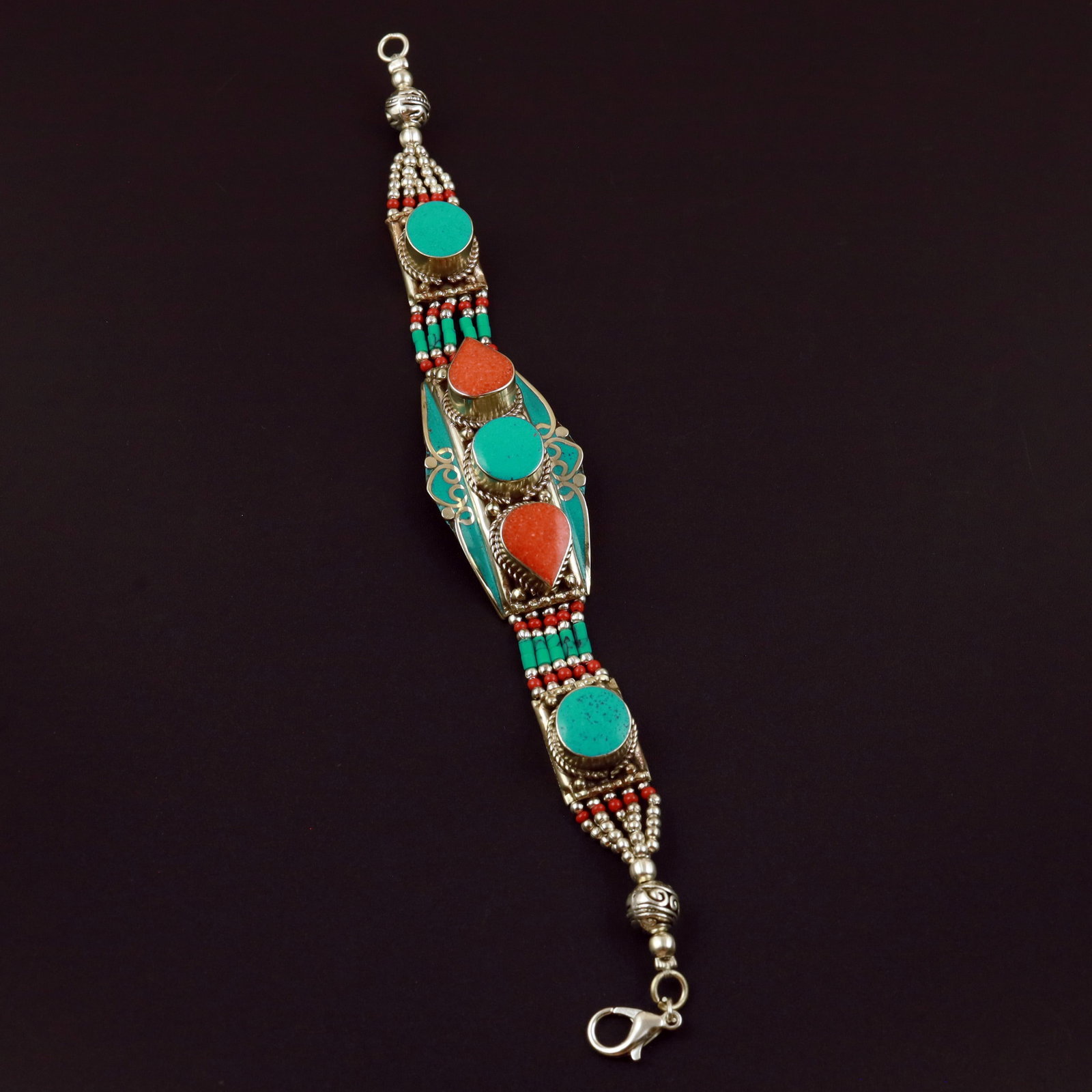 Tibetan Natural Turquoise & Coral Handmade Bold Bracelet: Product ID: 260513131638 Product - Tibetan Handmade Ethnic Bracelet Gemstone - Natural Turquoise & Coral Size - 7 Inch Weight - 50 Gram Approx Metal - Brass & Copper mix Metal Origin - Nepal Country/R