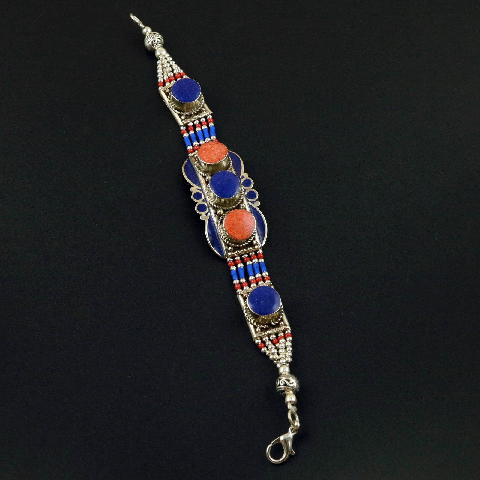 Tibetan Lapis Lazuli & Coral Handmade Ethnic Bracelet: Product ID: 260513130438 Product - Tibetan Handmade Ethnic Bracelet Gemstone - Natural Lapis Lazuli & Coral Size - 7 Inch Weight - 50 Gram Approx Metal - Brass & Copper mix Metal Origin - Nepal Countr