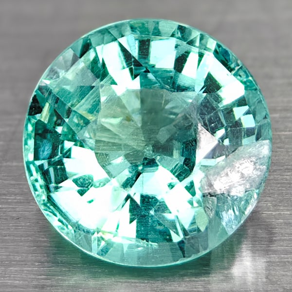 Natural Paraiba Color Apatite Gemstones 1.16 Ct. Round Shape 6.5 Mm.: Product ID: 100601153 Product Name: Natural Apatite Weight: 1.16 CT. Size: 6.5 X 6.5 X 4.4 MM. Shape: Round Color: Blueish Green Clarity:SI1 Luster: Good Gems Origin: Tanzania Treatment: Unheated Crys