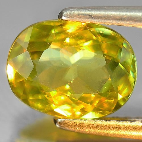 Natural Multi Color Sphene Gemstones with Rainbow Spark 1.91 Ct. Cushion Shape 9.2 x 7 Mm.: Product ID: 806505324 Product Name: Natural Sphene Weight: 1.91 CT. Size: 9.2 x 7 x 3.6 MM. Shape: Cushion Color: Intense Yellowish Green With Rainbow Spark Clarity:VSI Luster: Adamantine Gems Origin: