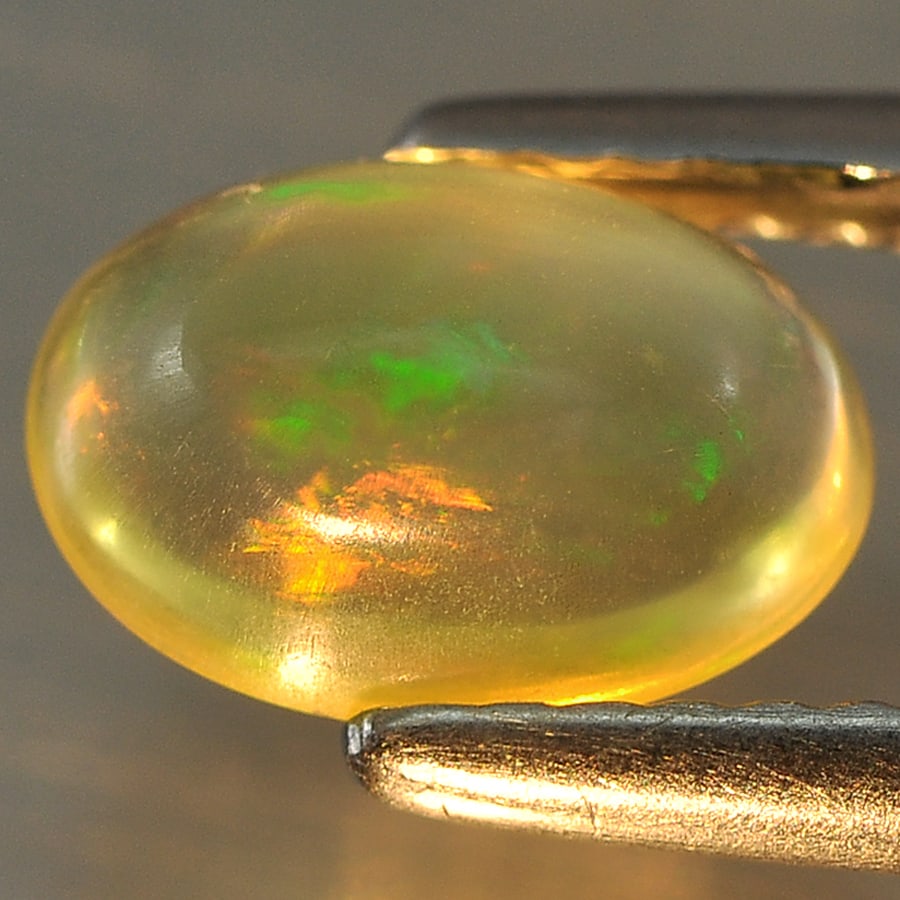 Natural Multi Color Opal Gemstones 1.05 Ct. Oval Cabochon Shape 8.3 x 5.9 Mm.: Product ID: 818708533 Product Name: Natural Opal Weight: 1.05 CT. Size: 8.3 x 5.9 x 4.3 MM. Shape: Oval Cabochon Color: Multi Color Clarity:Semi - Transparent Luster: Good Gems Origin: Ethiopia Treatm