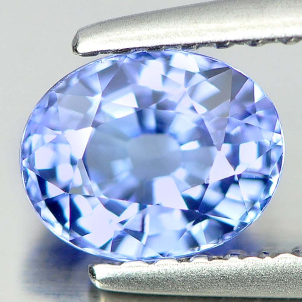 Natural Blue Tanzanite Gemstones 1.01 Ct. Clean Oval Shape 6.7 x 5.4 Mm.: Product ID: 807006532 Product Name: Natural Tanzanite Weight: 1.01 CT. Size: 6.7 x 5.4 x 3.8 MM. Shape: Oval Color: Blue Clarity:IF Luster: Very Good Gems Origin: Tanzania Treatment: Heated Crystal St