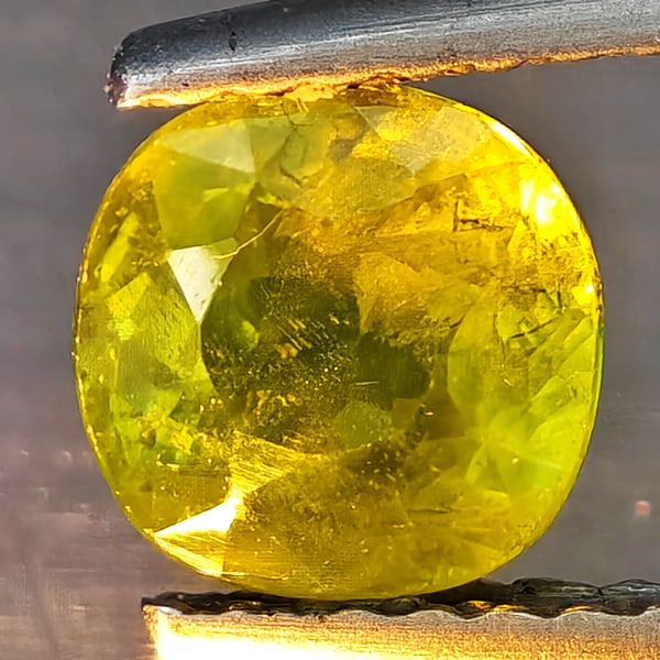 Natural Multi-Color Sphene Gemstones With Rainbow Spark 1.02Ct. Cushion Shape 5.9 x 5.9 Mm.: Product ID: 806509258 Product Name: Natural Gemstones Weight: 1.02 CT. Size: 5.9 x 5.9 x 3.9 MM. Shape: Cushion Shape Color: Multi-Color Clarity:SI1 Luster: Good Gems Origin: Madagascar Treatment: Unh