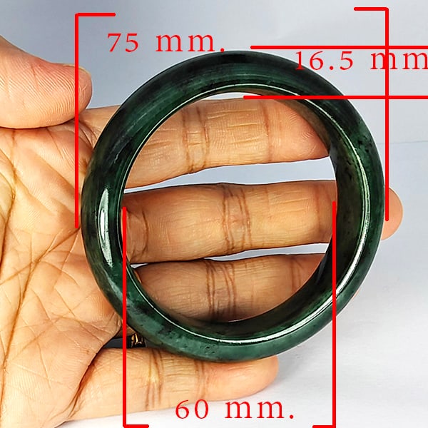 Natural Green Jade Bangle 424.25 Ct. Diameter 60 Mm. Gemstone from Thailand: Product ID: 819816050 Product Name: Natural Gemstones Weight: 424.25 CT. Size: 75 x 60 x 16.5 MM. Shape: Round Color: Multi-Color Clarity:Opaque Luster: Good Gems Origin: Thailand Treatment: Unheated 