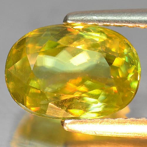Natural Green Sphene Gemstones With Rainbow Spark 2.42 Ct. Oval Shape 9.6 x 6.3 Mm.: Product ID: 806505267 Product Name: Natural Sphene Weight: 2.42 CT. Size: 9.6 x 6.3 x 4.3 MM. Shape: Oval Color: Green With Rainbow Spark Clarity:VSI Luster: Adamantine Gems Origin: Madagascar Treatme
