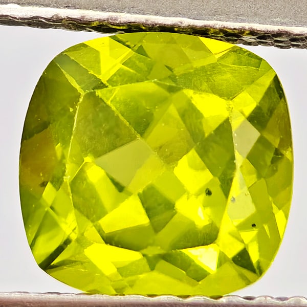 Natural Green Peridot Gemstones1.72 Ct. Cushion Shape 7.2 Mm.: Product ID: 805317214 Product Name: Natural Peridot Weight: 1.72 CT. Size: 7.2 x 7.2 x 4.7 MM. Shape: Cushion Shape Color: Green Clarity:VSI - SI1 Luster: Good Gems Origin: Pakistan Treatment: Unheate
