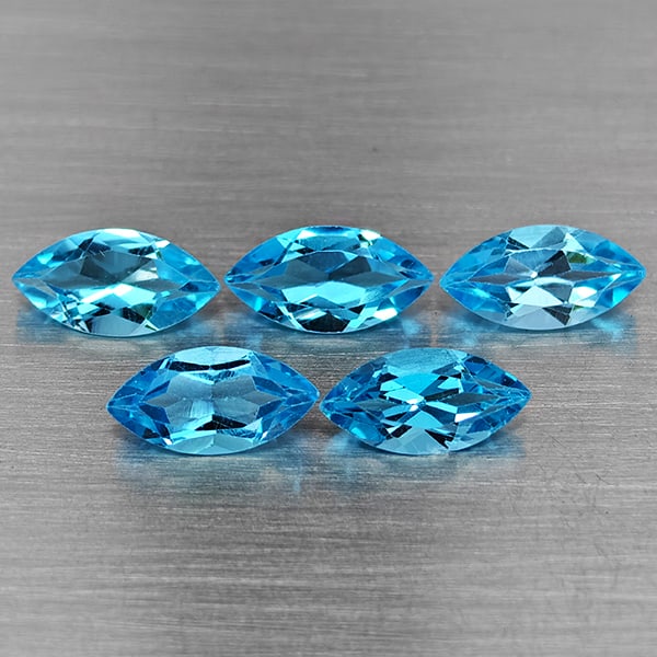 Natural Swiss Blue Topaz Gemstones 7.54 Ct. 5 Pcs. Marquise Shape 10 x 5 Mm.: Product ID: 807168722 Product Name: Natural Blue Topaz Weight: 7.54 CT. Size: 10 x 5 x 3.3 MM. Shape: Marquise Shape Color: Swiss Blue Clarity:VSI Luster: Good Gems Origin: Brazil Treatment: Treated C