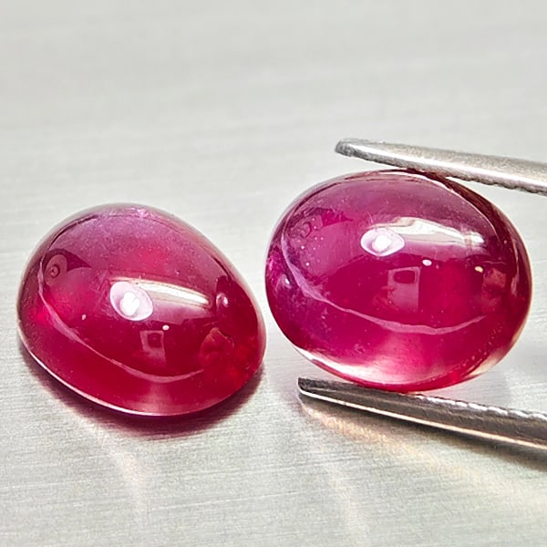 Natural Purplish Red Ruby Gemstones 9.47 Ct. 2 Pcs. Oval Cabochon Shape: Product ID: 805935243 Product Name: Natural Ruby Weight: 9.47 CT. Size: 10.3 x 8.3 x 5.5 to 10.1 x 8.1 x 5.2 MM. Shape: Oval Cabochon Color: Purplish Red Clarity:Semi - Transparent Luster: Good Gems O