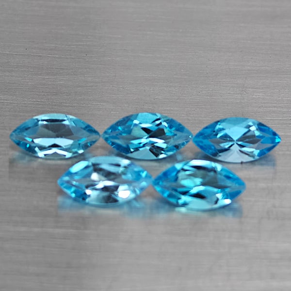 Natural Swiss Blue Topaz Gemstones 7.67 Ct. 5 Pcs. Marquise Shape 10 x 4.9 Mm.: Product ID: 807168724 Product Name: Natural Blue Topaz Weight: 7.67 CT. Size: 10 x 4.9 x 3.5 MM. Shape: Marquise Shape Color: Swiss Blue Clarity:VSI Luster: Good Gems Origin: Brazil Treatment: Treated