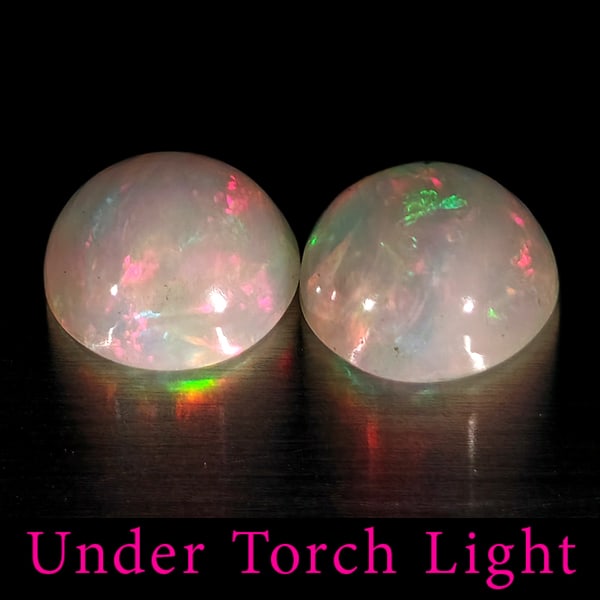 Natural Multi Color Opal Gemstones 1.70 Ct. 2 Pcs. Round Shape Cabochon 7.1 Mm.: Product ID: 818728213 Product Name: Natural Opal Weight: 1.70 CT. Size: 7.1 x 7.1 x 3.7 MM. Shape: Round Cabochon Color: Multi-Color Clarity:Semi - Transparent Luster: Good Gems Origin: Ethiopia Treat