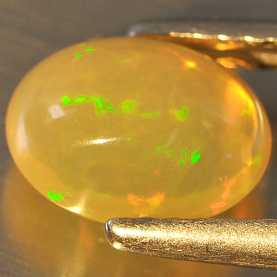 Natural Multi Color Opal Gemstones 1.04 Ct. Oval Cabochon Shape 8.5 x 6.6 Mm.: Product ID: 818707703 Product Name: Natural Opal Weight: 1.04 CT. Size: 8.5 x 6.6 x 4.1 MM. Shape: Oval Cabochon Color: Multi Color Clarity:Semi - Transparent Luster: Good Gems Origin: Ethiopia Treatm