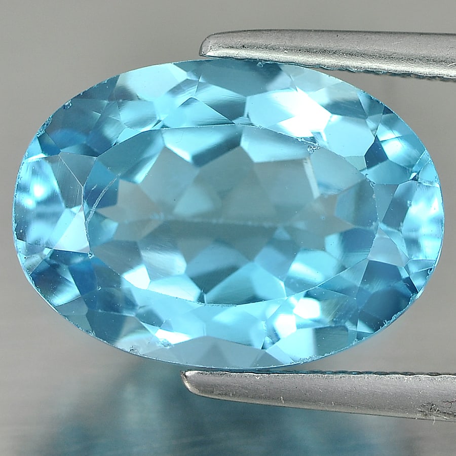Natural Swiss Blue Topaz Gemstones 7.77 Ct. Oval Shape 14.1 x 10.2 Mm.: Product ID: 807160782 Product Name: Natural Blue Topaz Weight: 7.77 CT. Size: 14.1 x 10.2 x 6.8 MM. Shape: Oval Color: Swiss Blue Clarity:VSI Luster: Good Gems Origin: Brazil Treatment: Treated Crysta