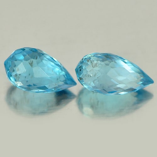 Natural Blue Topaz Gemstones 1.46 Ct. 2 Pcs. Briolette Shape 6.9 x 3.5 Mm.: Product ID: 807151359 Product Name: Natural Blue Topaz Weight: 1.46 CT. Size: 6.9 x 3.5 x 3.5 MM. Shape: Briolette Color: Blue Clarity:VSI Luster: Good Gems Origin: Brazil Treatment: Treated Crystal S
