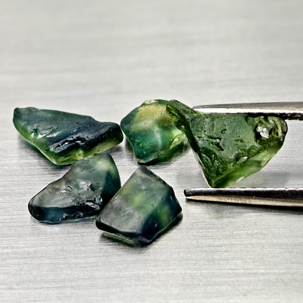 Natural Fancy Color Sapphire Gemstones 6.05 Ct. 5 Pcs. Rough Shape Mixed Size: Product ID: 806162504 Product Name: Natural Weight: 6.05 CT. Size: 8.8 x 6.5 x 3.6 to 6.3 x 5.3 x 3.5 MM. Shape: Rough Mixed Shape Color: Blue Clarity:Semi - Transparent Luster: Good Gems Origin: Tanz