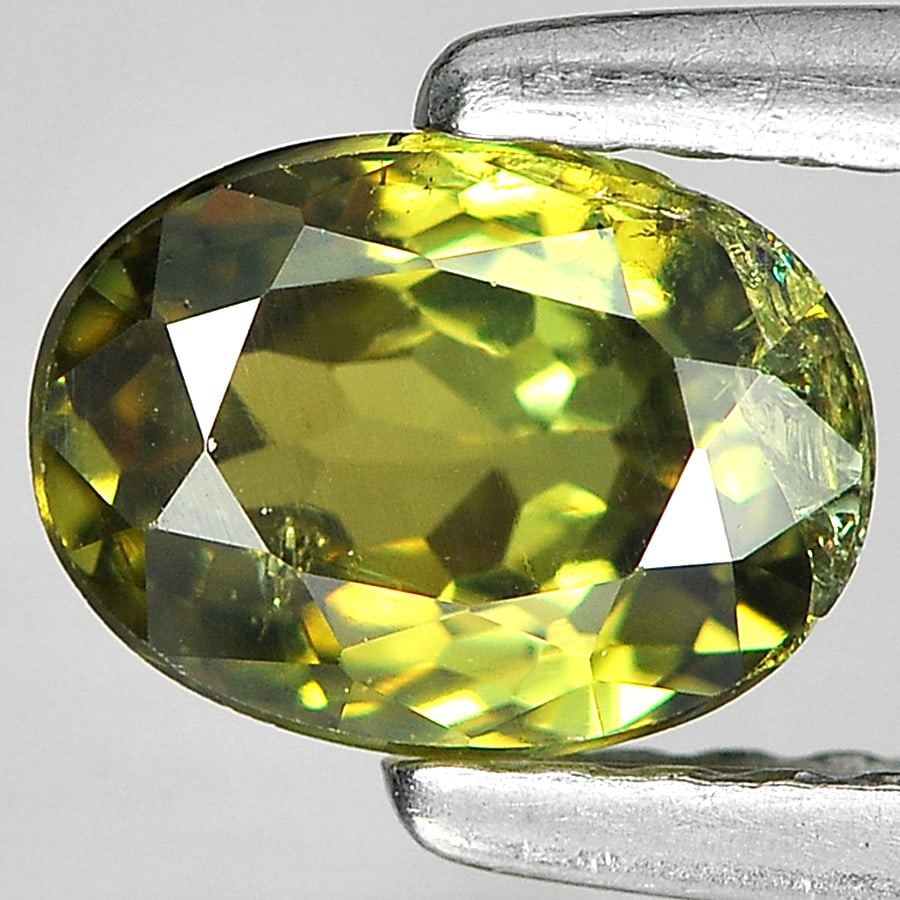 Natural Yellowish Green Demantoid Garnet Gemstone 0.98 Ct. Oval Shape 6.5 x 4.8 Mm. (1 of 3)