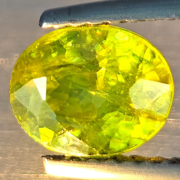 Natural Multi-Color With Rainbow Spark Sphene Gemstones 1.60 Ct. Oval Shape 7.7 x 6.3 Mm.: Product ID: 806509214 Product Name: Natural Sphene Weight: 1.60 CT. Size: 7.7 x 6.3 x 4.4 MM. Shape: Oval Shape Color: Multi-Color Clarity:SI1 Luster: Good Gems Origin: Madagascar Treatment: Unheated 