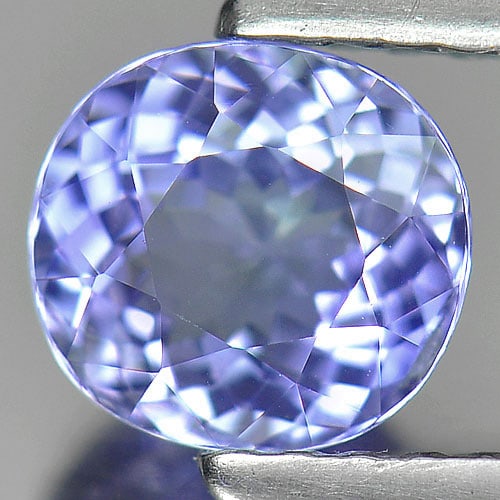 Natural Violet Blue Tanzanite Gemstones 0.93 Ct. Clean Oval Shape 6.1 x 5.6 Mm.: Product ID: 807004461 Product Name: Natural Tanzanite Weight: 0.93 CT. Size: 6.1 x 5.6 x 3.7 MM. Shape: Oval Color: Violet Blue Clarity:IF Luster: Very Good Gems Origin: Tanzania Treatment: Heated Cry