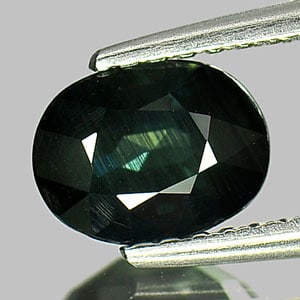 Natural Greenish Blue Sapphire Gemstones 1.07 Ct. Oval Shape 7.1 x 5.4 Mm.: Product ID: 806148602 Product Name: Natural Green Sapphire Weight: 1.07 CT. Size: 7.1 x 5.4 x 3.5 MM. Shape: Oval Color: Greenish Blue Clarity:SI1 Luster: Good Gems Origin: Thailand Treatment: Heated 