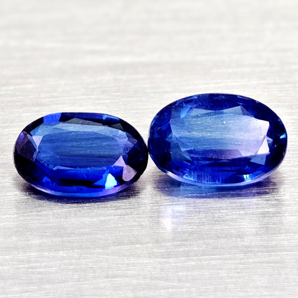 Natural Blue Kyanite Gemstones 1.20 Ct. 2 Pcs. Oval Shape Mixed Size: Product ID: 804204829 Product Name: Natural Kyanite Weight: 1.20 CT. Size: 6.2 x 4.2 x 2.9 to 6 x 4 x 2.2 MM. Shape: Oval Color: Blue Clarity:VSI - SI1 Luster: Good Gems Origin: Sri - Lanka Treatment: