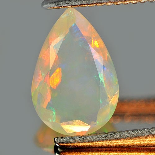 Natural Multi Color Play Of Colour Opal Gemstones 0.65 Ct. Pear Shape 9 x 6.1 Mm.: Product ID: 818726164 Product Name: Natural Opal Weight: 0.65 CT. Size: 9 x 6.1 x 3.3 MM. Shape: Pear Color: Multi Color Clarity:Semi - Transparent Luster: Iridescent Gems Origin: Ethiopia Treatment: 