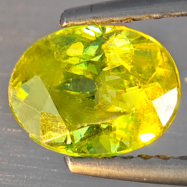 Natural Multi-Color With Rainbow Spark Sphene Gemstones 1.52 Ct. Oval Shape 7.8 x 6 Mm.: Product ID: 806509157 Product Name: Natural Sphene Weight: 1.52 CT. Size: 7.8 x 6 x 4.5 MM. Shape: Oval Shape Color: Multi-Color With Rainbow Spark Clarity:SI1 Luster: Good Gems Origin: Madagascar Tre