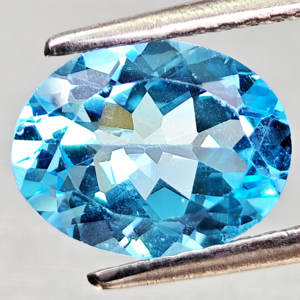 Natural Swiss Blue Topaz Gemstones 1.68 Ct. Oval Shape 8.9 x 7 Mm.: Product ID: 807168129 Product Name: Natural Blue Topaz Weight: 1.68 CT. Size: 8.9 x 7 x 3.9 MM. Shape: Oval Shape Color: Swiss Blue Clarity:VVS - VSI Luster: Good Gems Origin: Brazil Treatment: Treate