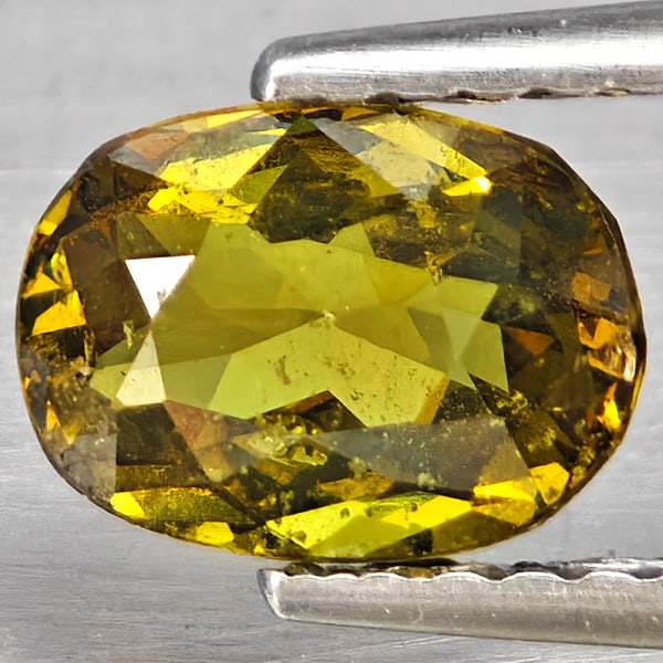 Natural Multi Color Green Demantoid Garnet Gemstones 0.75 Ct. Oval Shape 7.3 x 5.5 Mm.: Product ID: 802937410 Product Name: Natural Demantoid Weight: 0.75 CT. Size: 7.3 x 5.5 x 3 MM. Shape: Oval Shape Color: Multi-Color Green Clarity:SI1 Luster: Good Gems Origin: Madagascar Treatment: Un