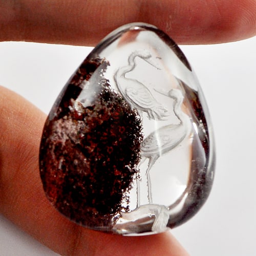 Natural Moss Quartz Birds Carving Inner 100.00 Ct. Pear Shape Cabochon 34 x 28 Mm.: Product ID: 805527036 Product Name: Natural Quartz Weight: 100.00 CT. Size: 34 x 28 x 16 MM. Shape: Pear Cabochon Color: White Clarity:Semi - Transparent Luster: Good Gems Origin: Thailand Treatment: 