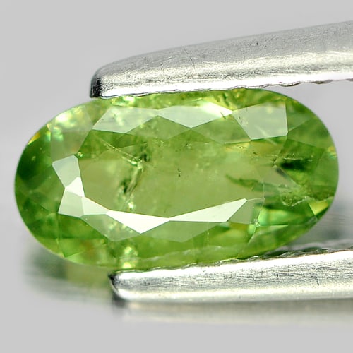 Natural Green Demantoid Garnet Gemstones 0.96 Ct. Oval Shape 8.5 x 4.7 Mm.: Product ID: 802919302 Product Name: Natural Demantoid Weight: 0.96 CT. Size: 8.5 x 4.7 x 2.6 MM. Shape: Oval Color: Green Clarity:SI Luster: Good Gems Origin: Madagascar , Africa Treatment: Unheated C