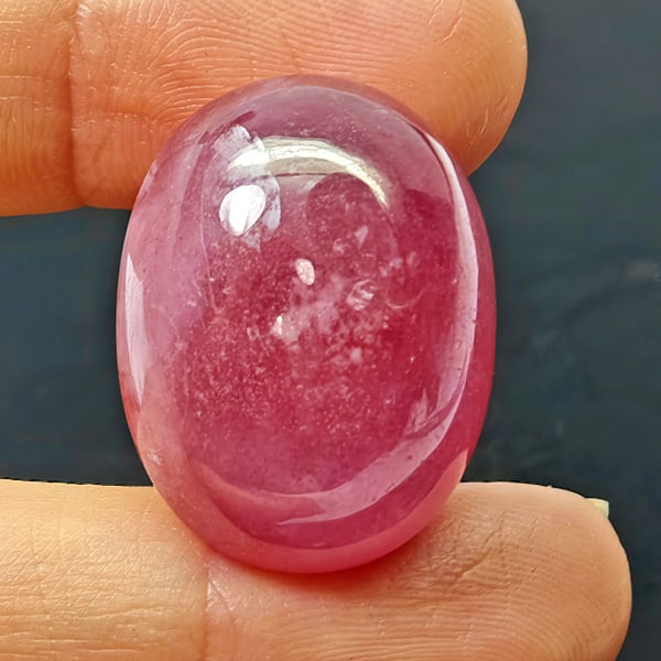 Natural Pink Red Ruby Gemstones 48.81 Ct. Oval Shape Cabochon 23 x 17.5 Mm.: Product ID: 805935308 Product Name: Natural Ruby Weight: 48.81 CT. Size: 23 x 17.5 x 10.5 MM. Shape: Oval Cabochon Color: Purplish Red Clarity:Opaque Luster: Good Gems Origin: Madagascar Treatment: He
