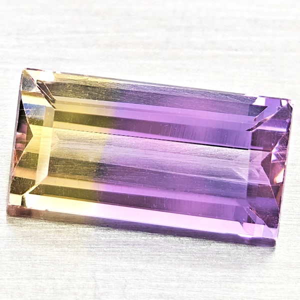 Natural Bi Color Ametrine Gemstones 2.60 Ct. Baguette Shape 12 x 6.2 Mm.: Product ID: 800408452 Product Name: Natural Ametrine Weight: 2.60 CT. Size: 12 x 6.2 x 4.5 MM. Shape: Baguette Color: Bi Color Clarity:VSI Luster: Good Gems Origin: Bolivia Treatment: Unheated Crystal