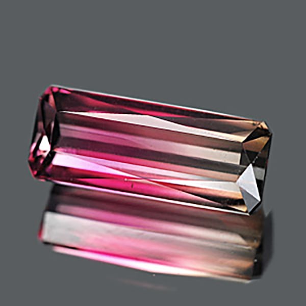 Natural Bi Color Tourmaline Gemstones 6.79 Ct. Octagon Shape 15.88 x 6.43 Mm.: Product ID: 807224367 Product Name: Natural Tourmaline Weight: 6.79 CT. Size: 15.88 x 6.43 x 5.96 MM. Shape: Octagon Color: Blue , Reddish Pink Clarity:IF Luster: Very Good Gems Origin: Nigeria Treatm