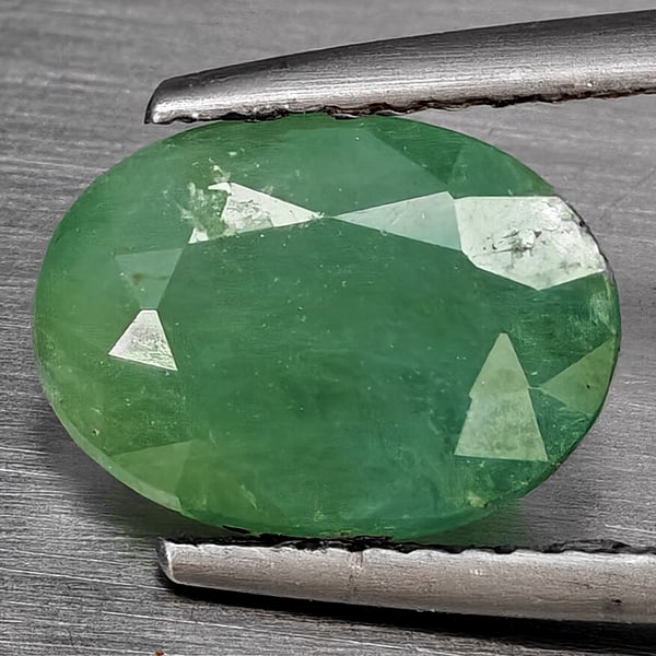 Natural Green Blueish Grandidierite Gemstones 3.07 Ct. Oval Shape 10.3 x 7.6 Mm.: Product ID: 803100023 Product Name: Natural Tsavorite Weight: 3.07 CT. Size: 10.3 x 7.6 x 5.9 MM. Shape: Oval Shape Color: Green Blueish Clarity:SI1 Luster: Good Gems Origin: Madagascar Treatment: Unh
