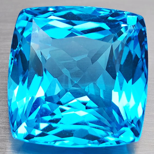 Natural Swiss Blue Topaz Gemstones 45.40 Ct. Cushion Shape 20 x 20 Mm.: Product ID: 807168688 Product Name: Natural Blue Topaz Weight: 45.40 CT. Size: 20 x 20 x 13.1 MM. Shape: Cushion Shape Color: Swiss Blue Clarity:VVS Luster: Good Gems Origin: Brazil Treatment: Treated