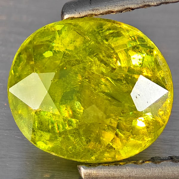 Natural Multi-Color With Rainbow Spark Sphene Gemstones 1.52 Ct. Oval Shape 7.5 x 6.6 Mm.: Product ID: 806509189 Product Name: Natural Sphene Weight: 1.52 CT. Size: 7.5 x 6.6 x 4.1 MM. Shape: Oval Shape Color: Multi-Color Clarity:SI1 Luster: Good Gems Origin: Madagascar Treatment: Unheated 