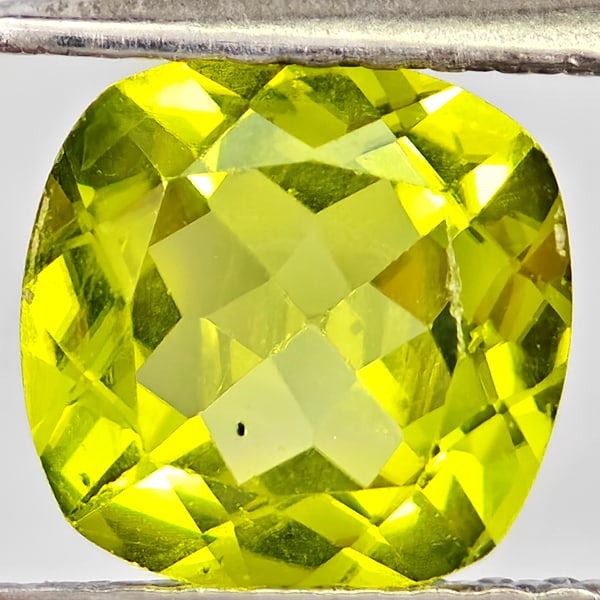 Natural Green Peridot Gemstones 1.41 Ct. Cushion Shape 7.1 Mm.: Product ID: 805317217 Product Name: Natural Peridot Weight: 1.41 CT. Size: 7.1 x 7.1 x 3.9 MM. Shape: Cushion Shape Color: Green Clarity:VSI - SI1 Luster: Good Gems Origin: Pakistan Treatment: Unheate