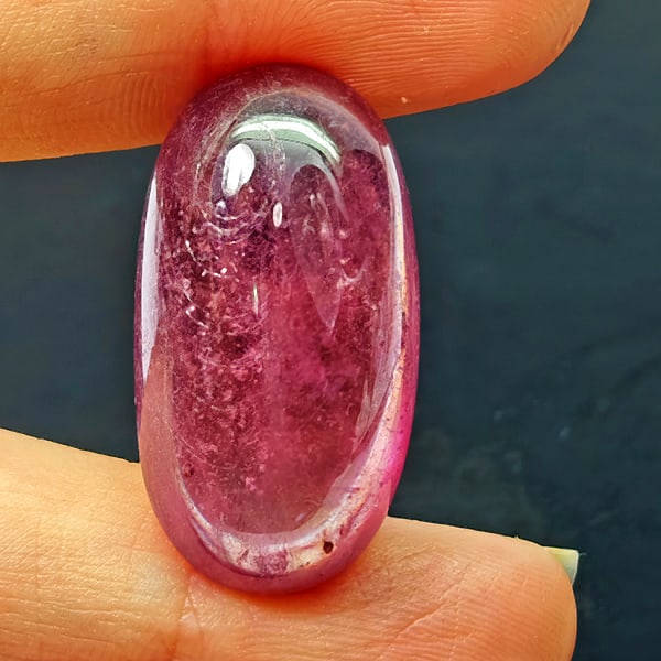 Natural Pink Red Ruby Gemstones 40.45 Ct. Oval Cabochon Shape 27 x 15 Mm.: Product ID: 805935303 Product Name: Natural Ruby Weight: 40.45 CT. Size: 27 x 15 x 8.8 MM. Shape: Oval Cabochon Color: Purplish Red Clarity:Opaque Luster: Good Gems Origin: Madagascar Treatment: Heate