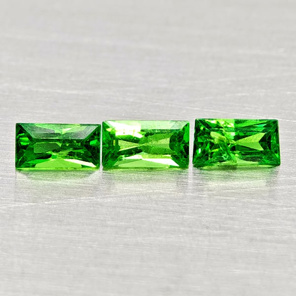 Natural Green Tsavorite Garnet Gemstones 0.47 Ct. 3 Pcs. Baguette Shape 4.2 x 2.2 Mm.: Product ID: 803005022 Product Name: Natural Tsavorite Weight: 0.47 CT. Size: 4.2 x 2.2 x 1.9 MM. Shape: Baguette Color: Green Clarity:SI1 Luster: Good Gems Origin: Tanzania Treatment: Unheated Crystal