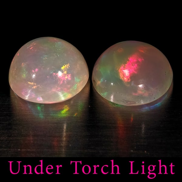 Natural Multi Color Opal Gemstones 1.47 Ct. 2 Pcs. Round Cabochon Shape 7 Mm.: Product ID: 818728280 Product Name: Natural Opal Weight: 1.47 CT. Size: 7 x 7 x 3.9 MM. Shape: Round Color: Multi-Color Clarity:Semi - Transparent Luster: Good Gems Origin: Ethiopia Treatment: Unheate