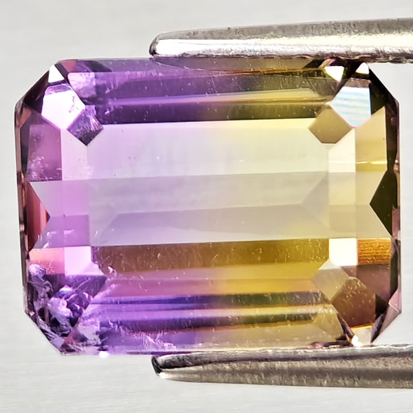 Natural Bi Color Ametrine Gemstones 3.71 Ct. Octagon Shape 10.2 x 8 Mm.: Product ID: 800408258 Product Name: Natural Ametrine Weight: 3.71 CT. Size: 10.2 x 8 x 5.9 MM. Shape: Octagon Color: Bi Color Clarity:VSI Luster: Good Gems Origin: Bolivia Treatment: Unheated Crystal 
