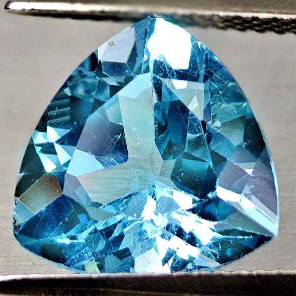 Natural Swiss Blue Topaz Gemstones 6.04 Ct. Trilliant Shape 11.9 Mm.: Product ID: 807167928 Product Name: Natural Blue Topaz Weight: 6.04 CT. Size: 11.9 x 11.9 x 7 MM. Shape: Trilliant Color: Swiss Blue Clarity:VSI Luster: Good Gems Origin: Brazil Treatment: Treated Cry