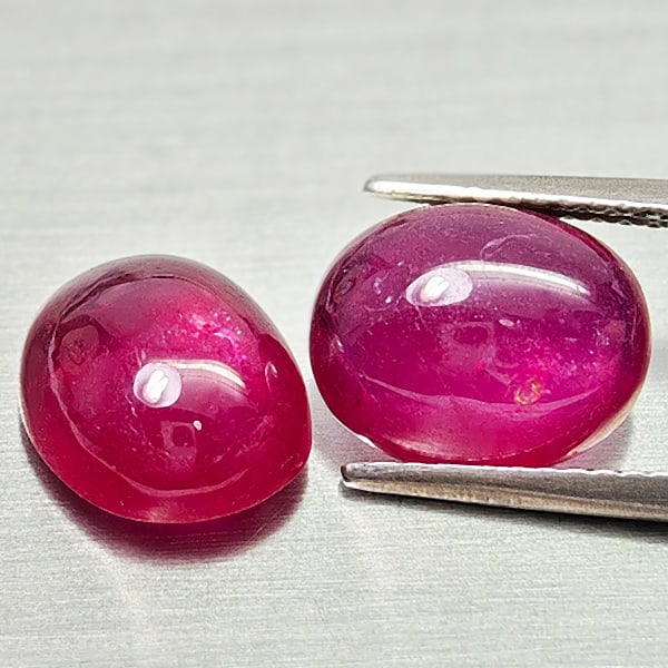 Natural Purplish Red Ruby Gemstones 8.46 Ct. 2 Pcs. Oval Shape Cabochon: Product ID: 805935245 Product Name: Natural Ruby Weight: 8.95 CT. Size: 10 x 8.2 x 5.2 to 10.2 x 8.4 x 4.9 MM. Shape: Oval Cabochon Color: Purplish Red Clarity:Semi - Transparent Luster: Good Gems Ori