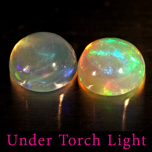 Natural Multi Color Opal Gemstones 1.74 Ct. 2 Pcs. Round Cabochon Shape 7 Mm.: Product ID: 818728189 Product Name: Natural Opal Weight: 1.74 CT. Size: 7 x 7 x 3.5 MM. Shape: Round Cabochon Color: Multi-Color Clarity:Semi - Transparent Luster: Good Gems Origin: Ethiopia Treatment