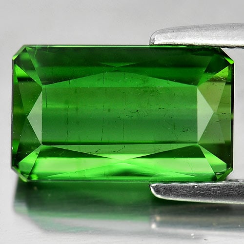 Natural Green Tourmaline Gemstones 4.46 Ct. Octagon Shape 11.7 x 7.2 Mm.: Product ID: 807232461 Product Name: Natural Tourmaline Weight: 4.46 CT. Size: 11.7 x 7.2 x 5.3 MM. Shape: Octagon Color: Green Clarity:VSI Luster: Very Good Gems Origin: Nigeria Treatment: Unheated Cr