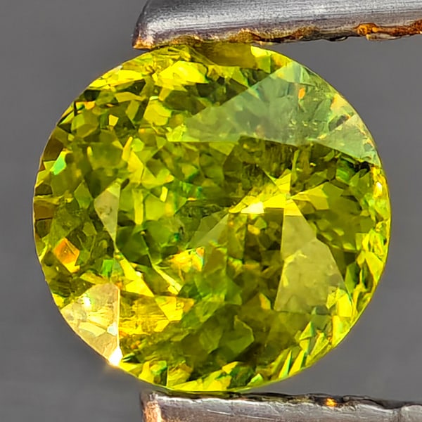 Natural Multi-Color With Rainbow Spark Sphene Gemstones 0.58 Ct. Round Shape 5.1 Mm.: Product ID: 806509286 Product Name: Natural Sphene Weight: 0.58 CT. Size: 5.1 x 5.1 x 3.2 MM. Shape: Round Shape Color: Multi-Color Clarity:SI1 Luster: Good Gems Origin: Madagascar Treatment: Unheated