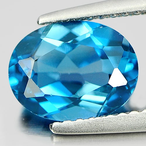 Natural London Blue Topaz Gemstones 2.21 Ct. Oval Shape 9.2 x 7.1 Mm.: Product ID: 807160994 Product Name: Natural Blue Topaz Weight: 2.21 CT. Size: 9.2 x 7.1 x 4.4 MM. Shape: Oval Color: London Blue Clarity:VVS Luster: Good Gems Origin: Brazil Treatment: Treated Crystal