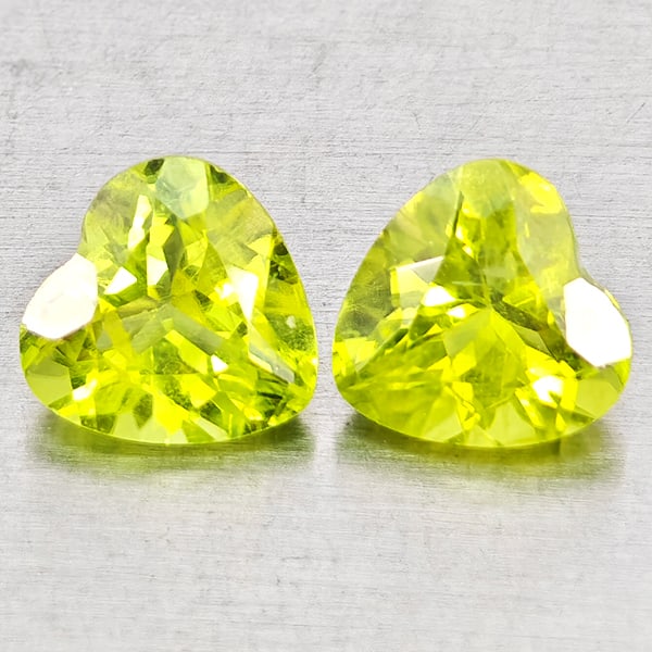 Natural Green Peridot Gemstones 1.74 Ct. 2 Pcs. Heart Shape 6 x 6 Mm.: Product ID: 805317336 Product Name: Natural Peridot Weight: 1.74 CT. Size: 6 x 6 x 4 MM. Shape: Heart Shape Color: Green Clarity:VSI - SI1 Luster: Good Gems Origin: Pakistan Treatment: Unheated Crysta